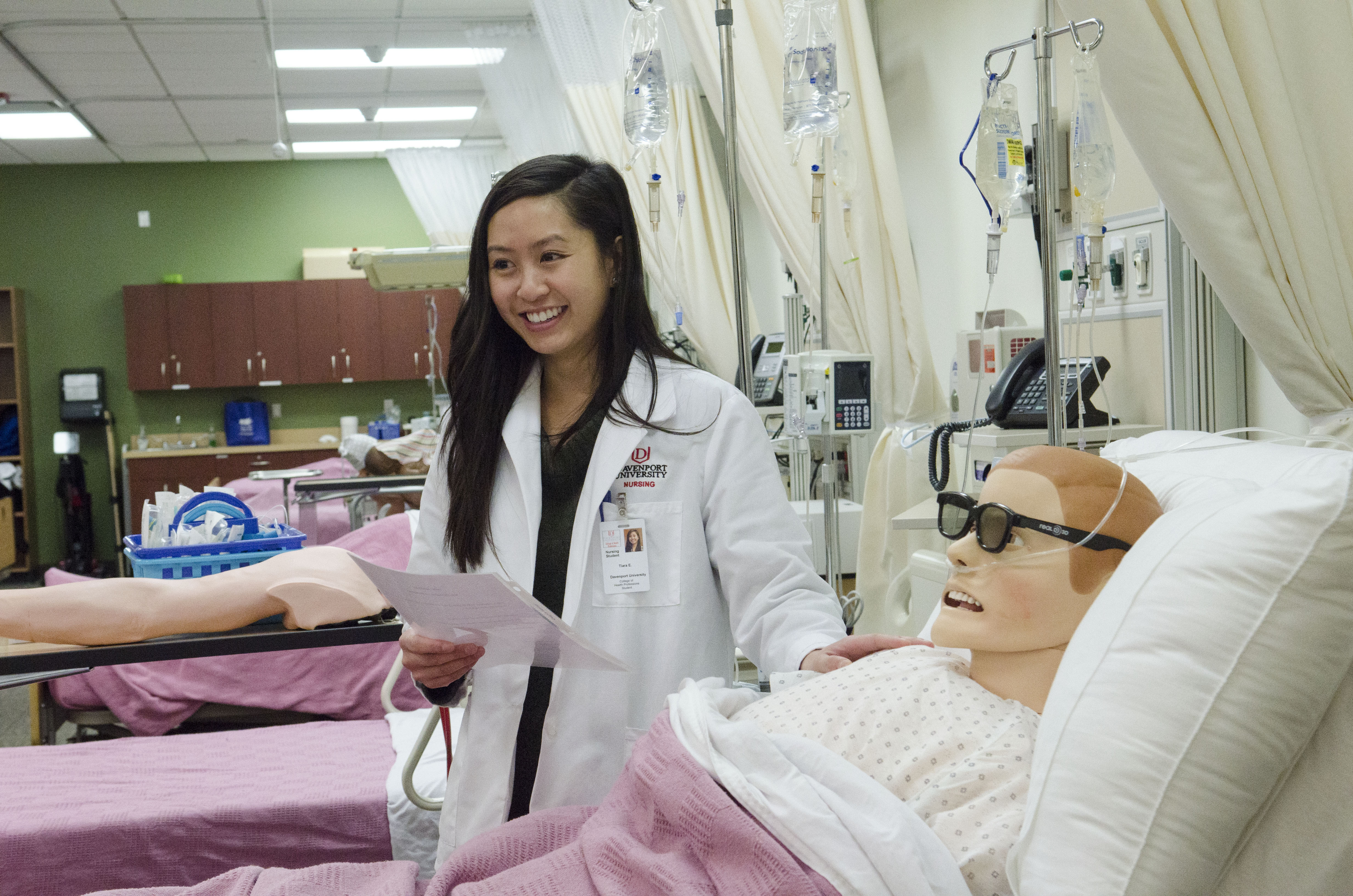 Tiara Escondo, a nursing student, with a simulator